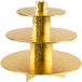 A gold plated Enjay three tiered cupcake stand on a table.