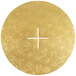 A circular gold plate with a cross on it.