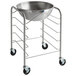 A Vollrath stainless steel mobile mixing bowl stand with a metal bowl on it.
