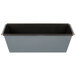 A Matfer Bourgeat flared bread loaf pan with a black and grey surface and black rim.