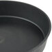 A close up of a black Matfer Bourgeat tart/cake pan.