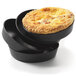 A stack of Matfer Bourgeat black tartlet pans with a pie in one of them.