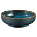 A close-up of a blue and black Oneida Studio Pottery Blue Moss ramekin.