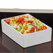 A white rectangular Bon Chef bowl with pasta salad on a counter.