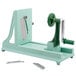 A green and silver Benriner manual spiralizer.