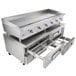 A large stainless steel countertop with a Cooking Performance Group gas griddle and refrigerated chef base with drawers.