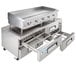 A large stainless steel countertop griddle with refrigerated drawers.