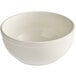 An ivory Acopa stoneware nappie bowl with a rolled edge on a white surface.