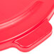 A red Rubbermaid lid with a handle for a 44 gallon trash can.