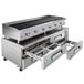 A Cooking Performance Group stainless steel gas lava briquette charbroiler over a refrigerated chef base with drawers.