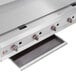 A stainless steel Cooking Performance Group gas countertop griddle with manual controls.