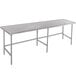 An Advance Tabco stainless steel work table with metal legs.