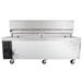 A large stainless steel and black Cooking Performance Group gas countertop griddle with refrigerated chef base.