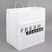 A white rigid plastic shopper bag with handles and "Fresh Flavor" printing.