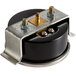 A black round VacPak-It vacuum gauge with a metal plate and screws.