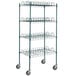 A green metal wire rack with shelves and wheels.
