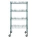 A green metal wire shelving rack with wheels.