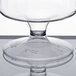 A clear plastic pedestal wine cup with a clear glass bowl and base.