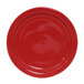 A white Tuxton bread and butter plate with a red circle and ripples.