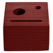 A mahogany wood block check presenter with a face cut out.