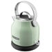 A mint green KitchenAid electric kettle with a handle.
