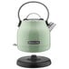 A pistachio green KitchenAid electric kettle with a black handle.