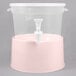 A translucent plastic beverage dispenser with a white lid and rose base.