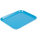 A blue Cambro Camlite tray on a table.