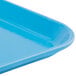 A close-up of a blue rectangular Cambro Camlite tray.