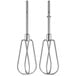 A pair of metal whisks with a white handle.