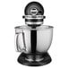 A KitchenAid Artisan Series Black Matte stand mixer with a black and silver bowl.