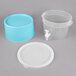 A translucent plastic container with a blue base, lid, and spigot.
