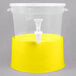 A translucent yellow plastic beverage dispenser with a white lid.