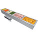 A Hatco drop-in hot food well with four compartments on a counter full of food.
