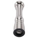 A stainless steel pepper grinder with a black rubber handle.