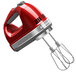 A red KitchenAid 9-speed hand mixer with silver accents.