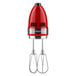 A red and silver KitchenAid hand mixer.