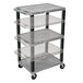 A gray Luxor Tuffy adjustable height computer cart with black legs and three plastic shelves.