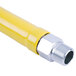 A yellow T&S Safe-T-Link gas hose with silver metal fittings.