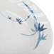 A close-up of a Thunder Group Blue Bamboo melamine plate with blue and white designs.