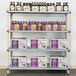 A MetroMax shelving unit with shelves holding bottles and boxes in a brewery tasting room.