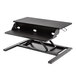 A black Luxor adjustable two-tier standing desktop desk.