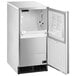 A white and silver Hoshizaki undercounter ice machine with the door open.