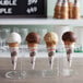 A clear case of Dutch Treat sugar cones filled with ice cream.