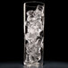 A clear glass with Hoshizaki top hat ice cubes in it.
