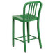 A green metal Flash Furniture counter height stool with a vertical slat back.