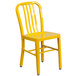 A yellow metal chair with a yellow chair with metal legs and a vertical slat back.