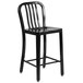 A Flash Furniture black metal counter height stool with a vertical slat back.