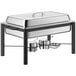 An Acopa stainless steel chafing dish with a lid on a table in an outdoor catering setup.