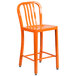 An orange Flash Furniture metal outdoor counter height stool with a vertical slat back.